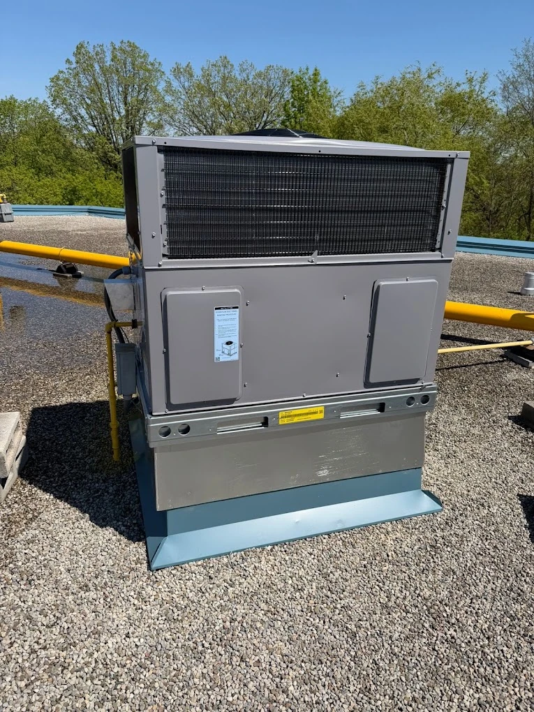 Rooftop commercial packaged heating and cooling unit installed on a flat roof.