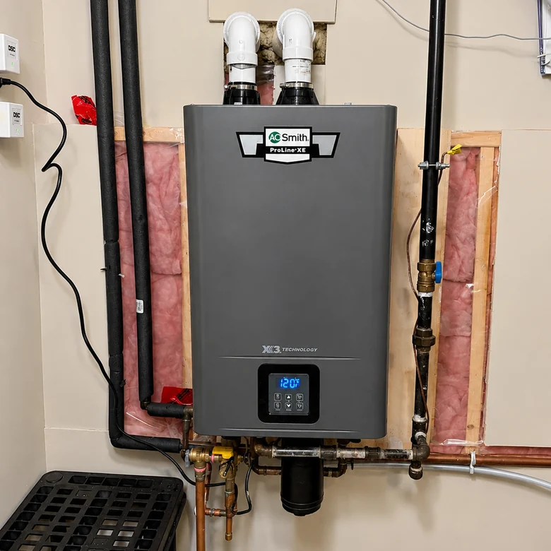 Wall-mounted tankless water heater with copper and gas connections, its display reading 120 degrees.